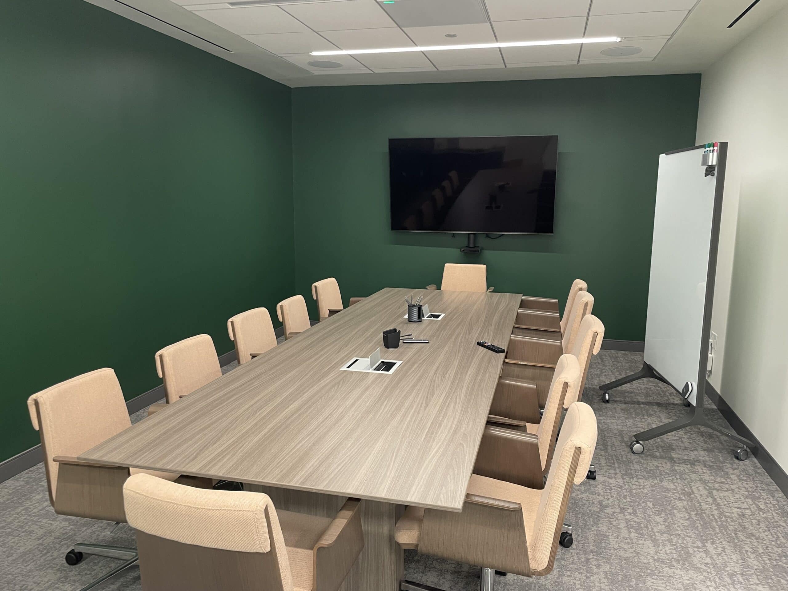 AV installation services for a conference room with meeting table and wall-mounted display