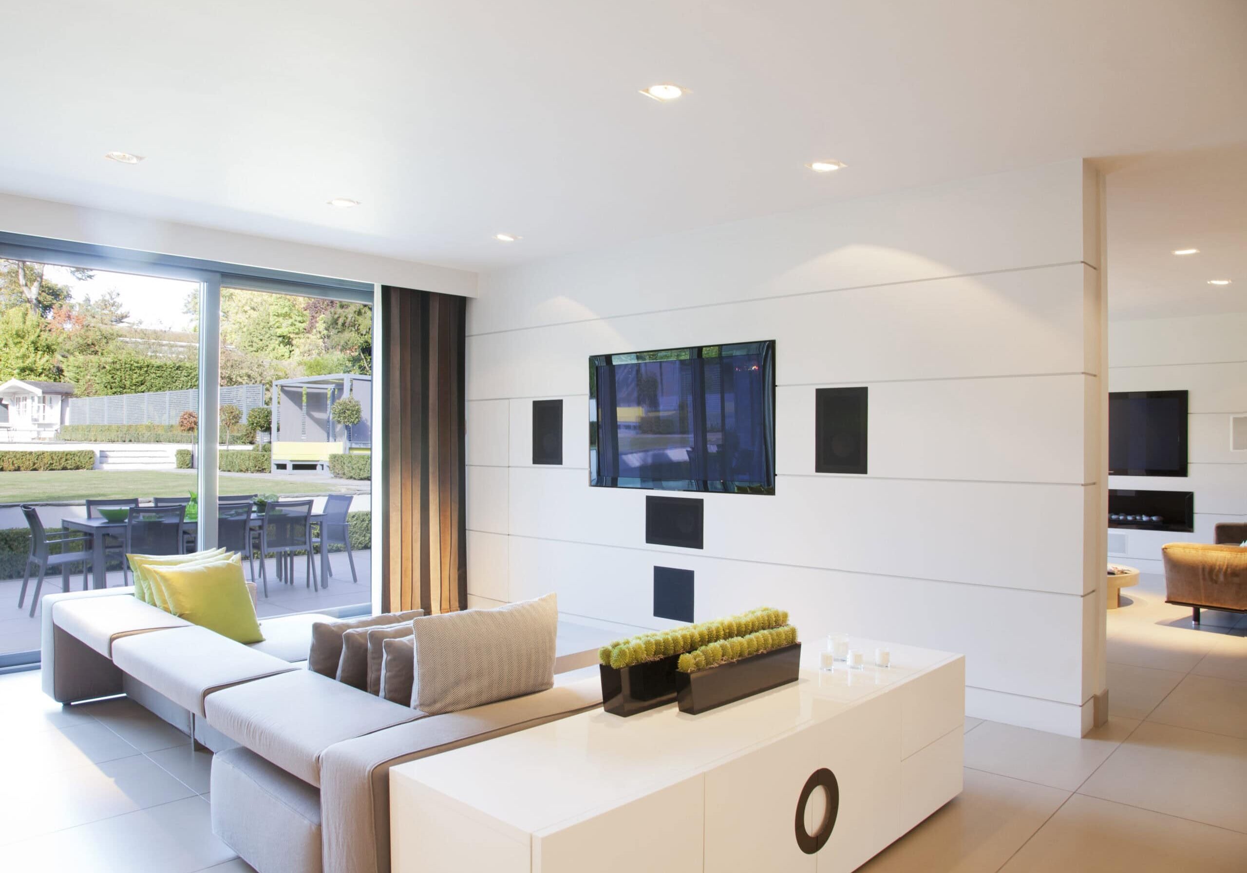 Smart home automation with multi-room audio and wall-mounted entertainment system